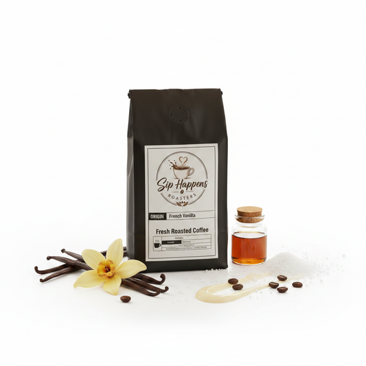 A bag of Sip Happens Coffee Fresh Roasted Coffee in French Vanilla, displayed with vanilla beans, a vanilla flower, a small bottle of vanilla extract, and coffee beans on a white background.